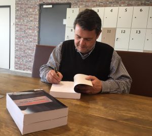 Johann Botha signing books